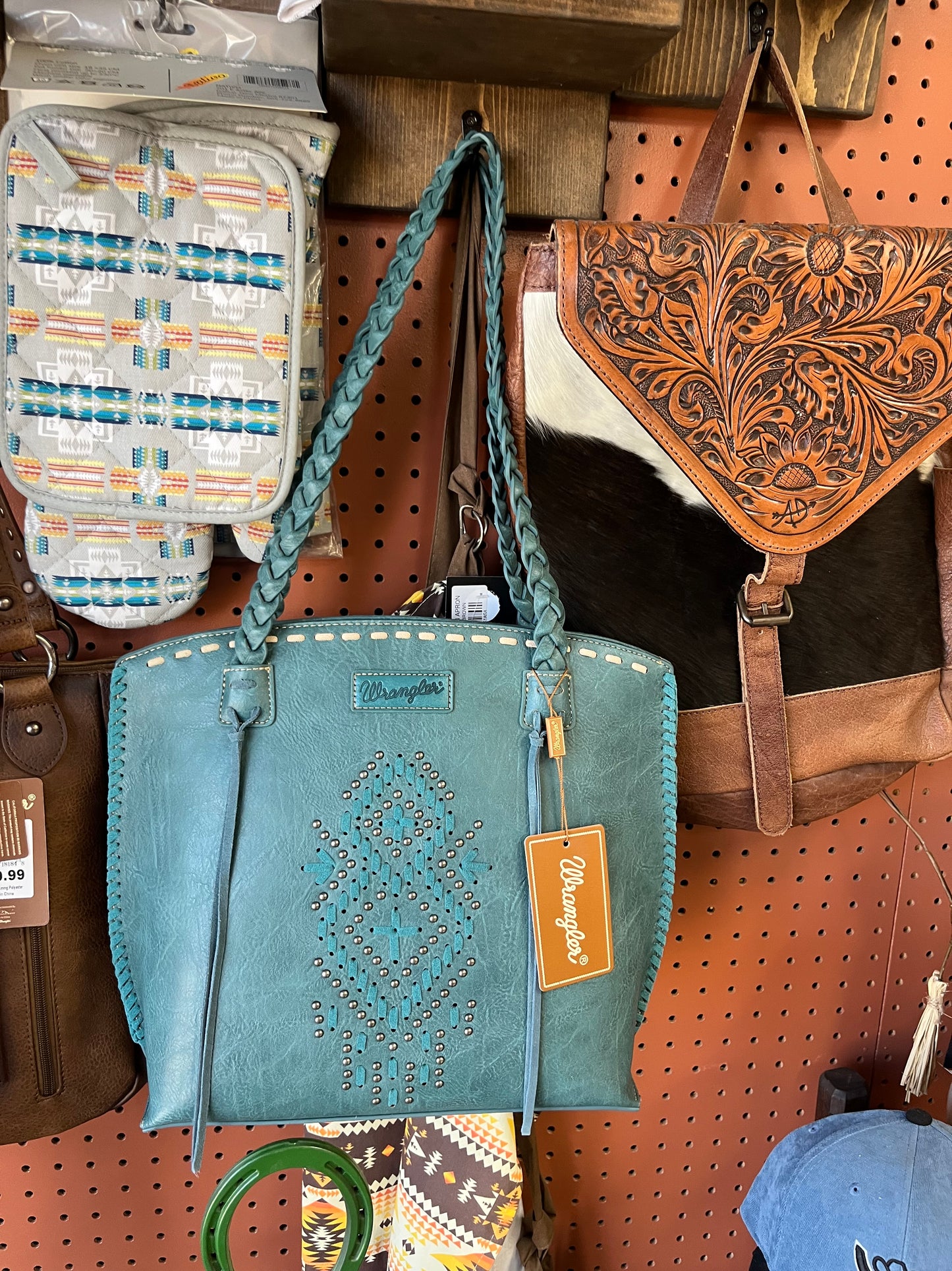 Blue leather wrangler purse with rivets and whipstitching